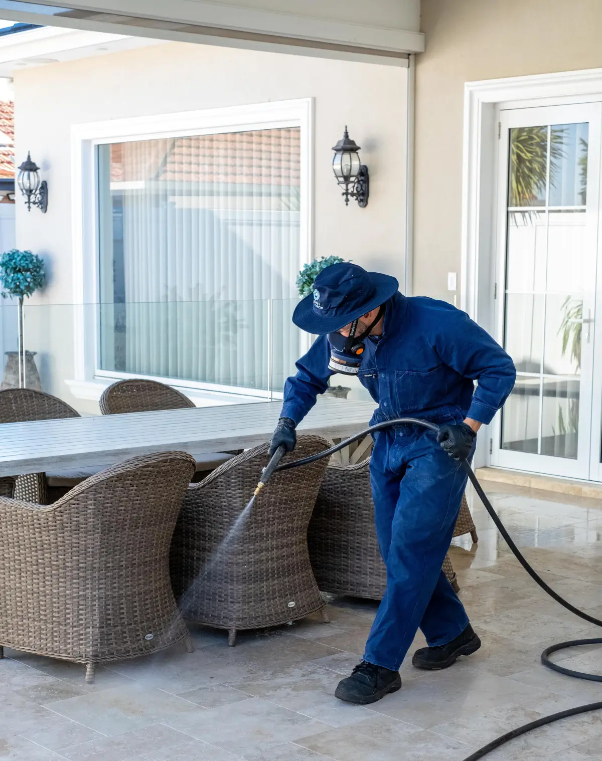 A Sydney Pest Crew technician spraying pesticides
